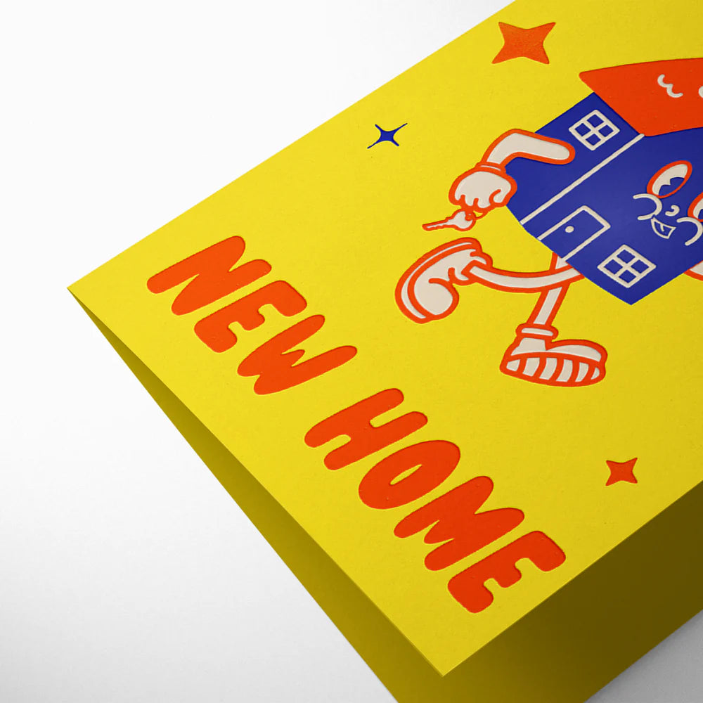 Yellow box with cartoon house and 'New Home' text on a white background