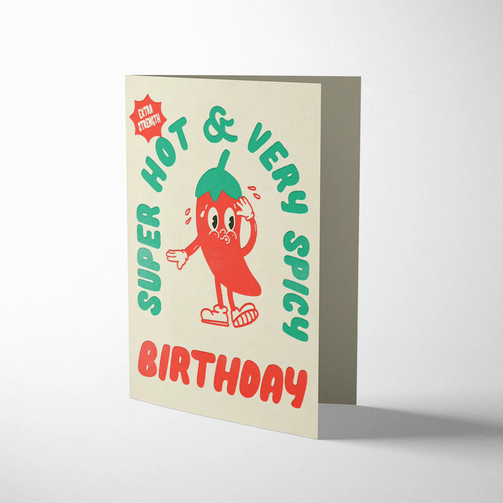Birthday card with a cartoon pepper character and text on a beige background