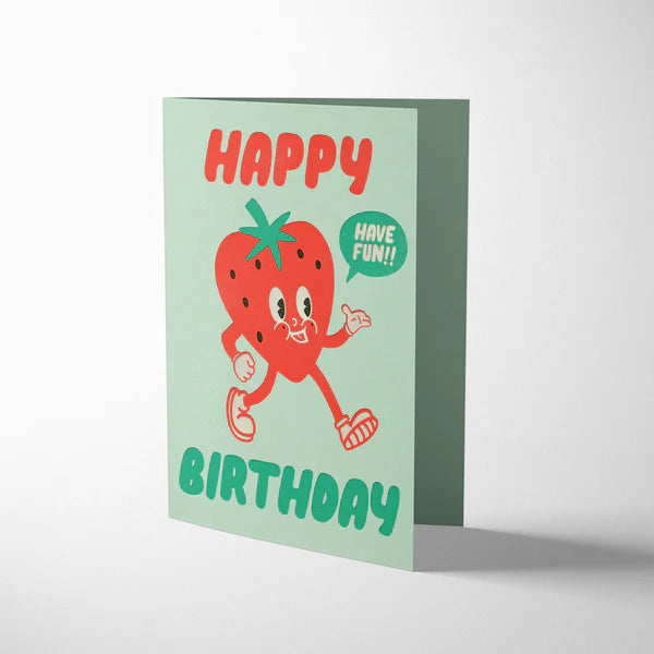 Birthday card with a cartoon strawberry character on a light green background