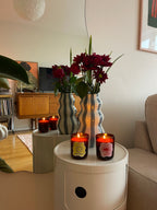 Rooted earthy scented candle styled with decorative homeware