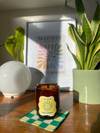 Sun Dance tropical scented candle styled with home accessories