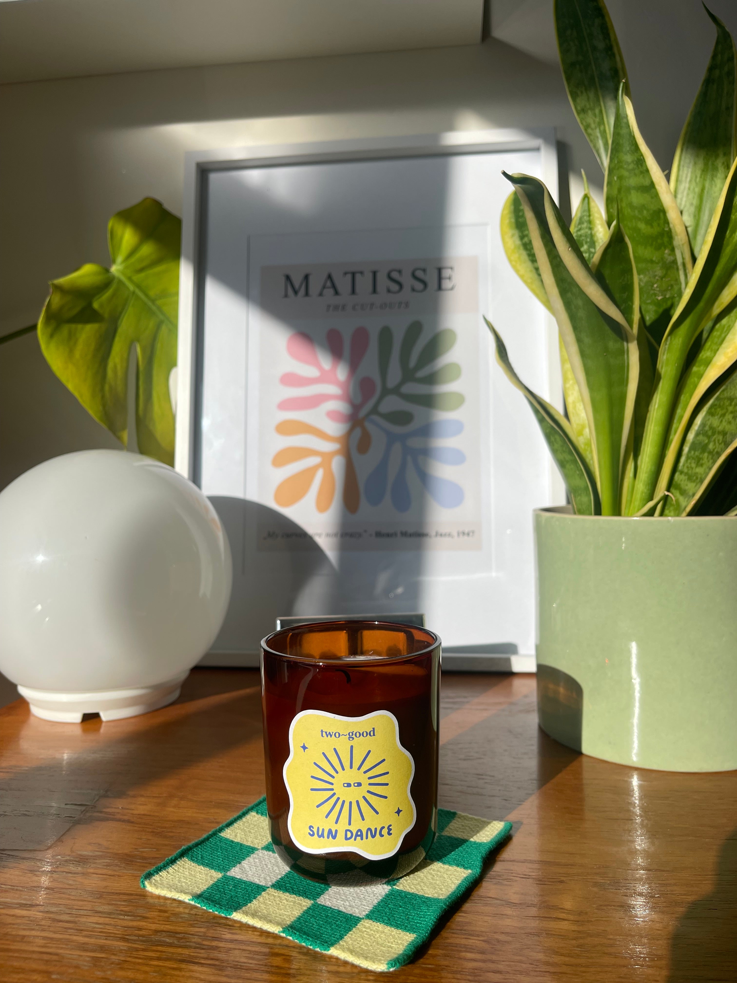 Sun Dance tropical scented candle styled with home accessories